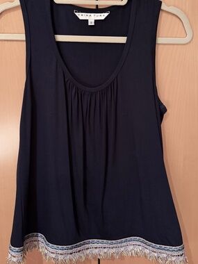 Trina Turk Sleeveless Fringe Hem Tank Top in a deep dark navy
